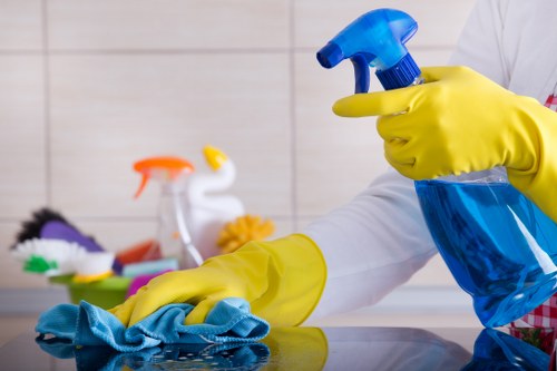 Carpet cleaning staff applying safe working practices in a domestic property